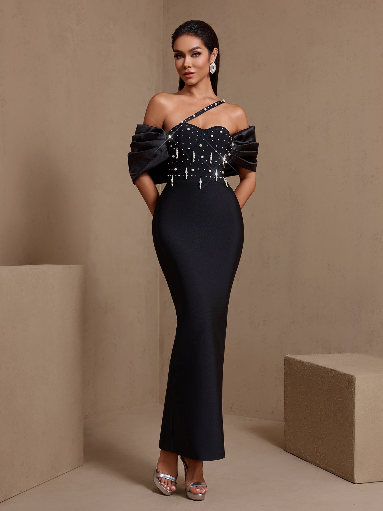 Black asymmetric pearl cascade bandage maxi dress, front view