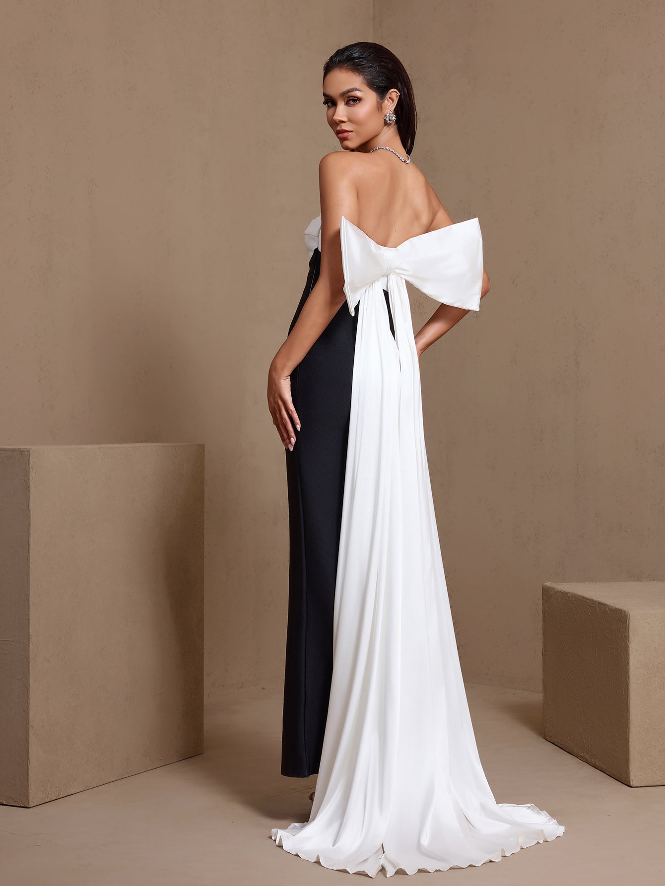 Black and white bow detail strapless bandage maxi dress, open back view