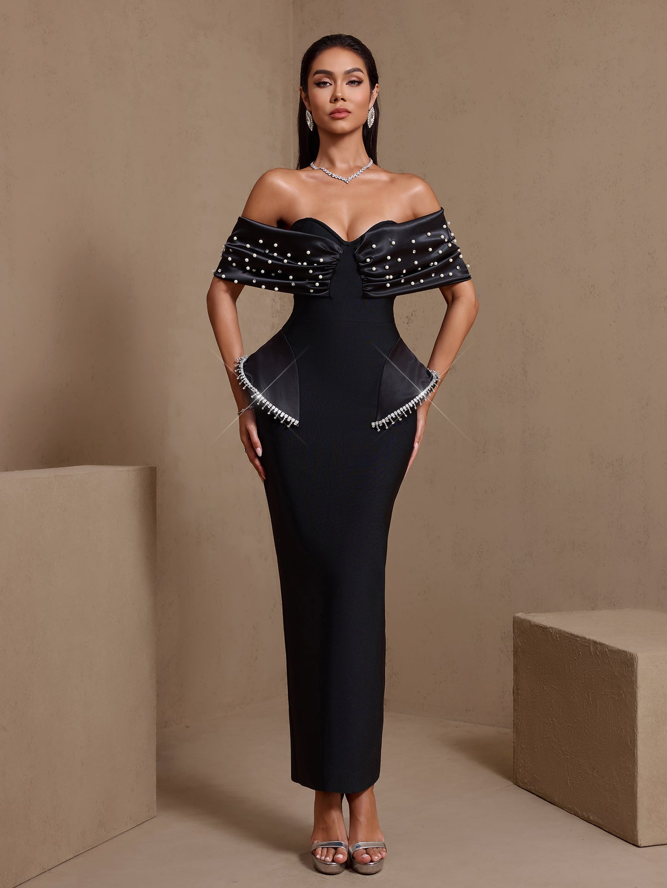 Black pearl-embellished off-shoulder bandage maxi dress, full front view