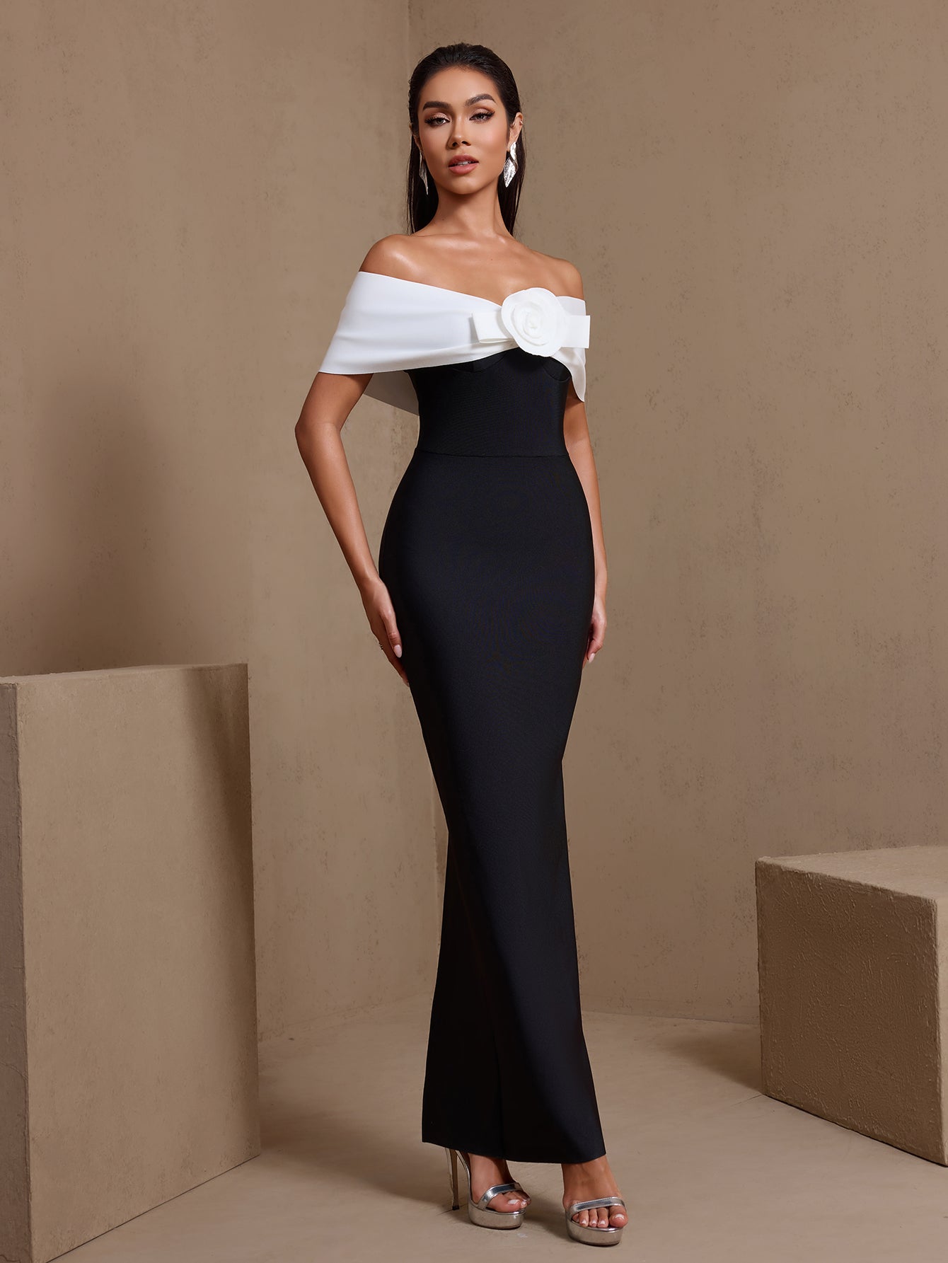 Black rosette off-shoulder bandage maxi dress, side view