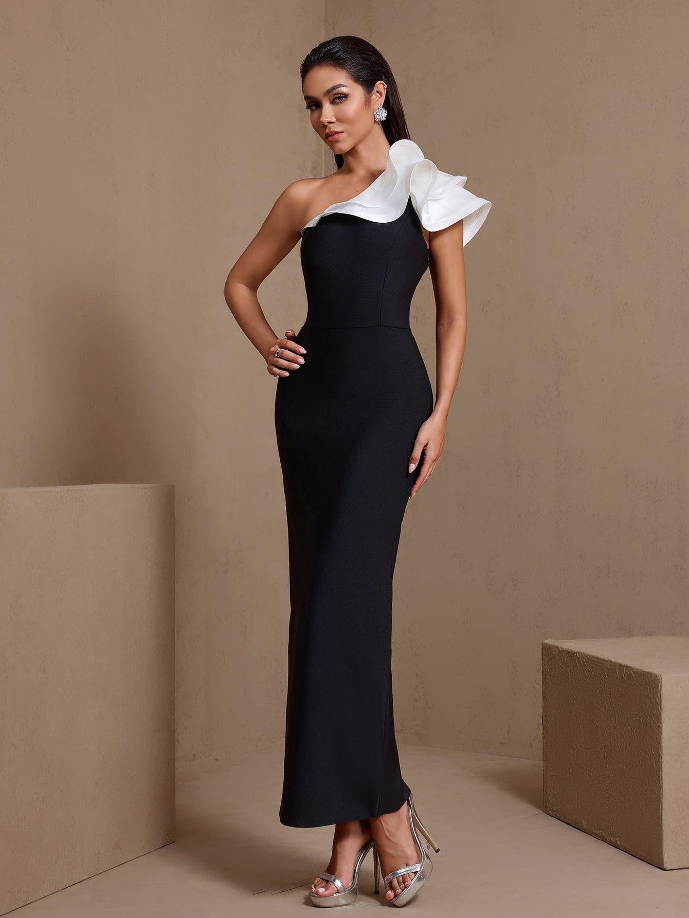 Black and white ruffled one-shoulder bandage maxi dress, front view