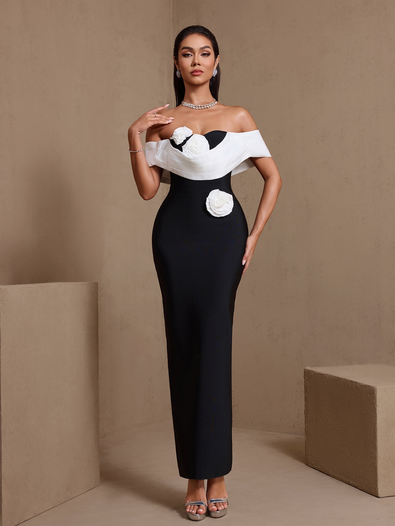 Black sculpted rosette off-shoulder bandage maxi dress, full-length front view