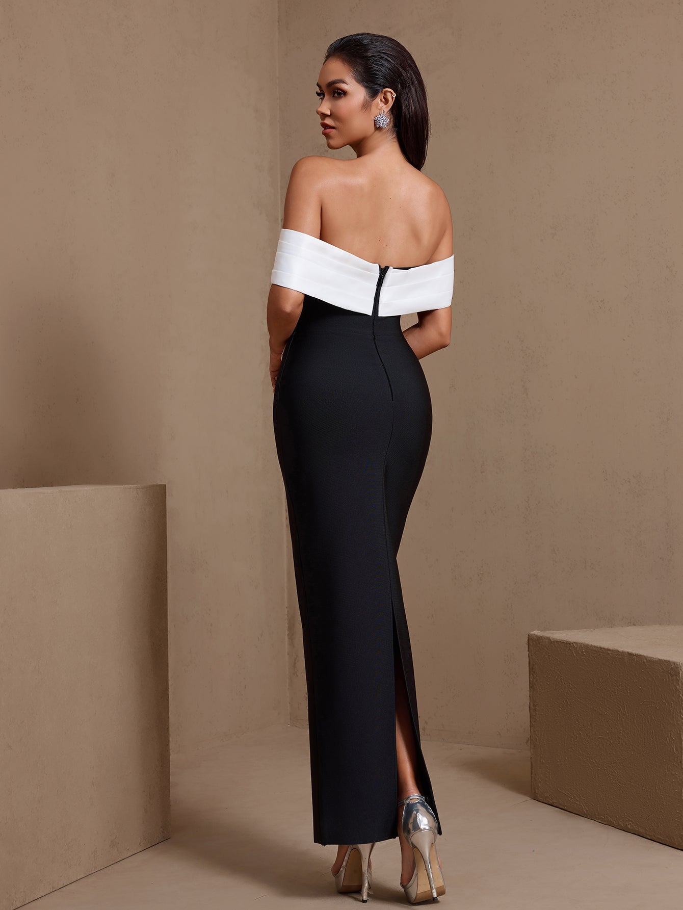 Black sculpted rosette off-shoulder bandage maxi dress, rear view