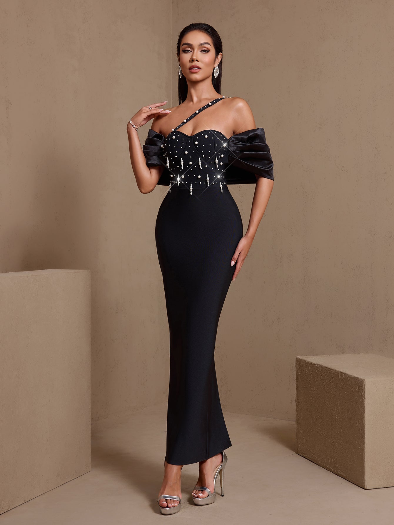 Black asymmetric pearl cascade bandage maxi dress, side view