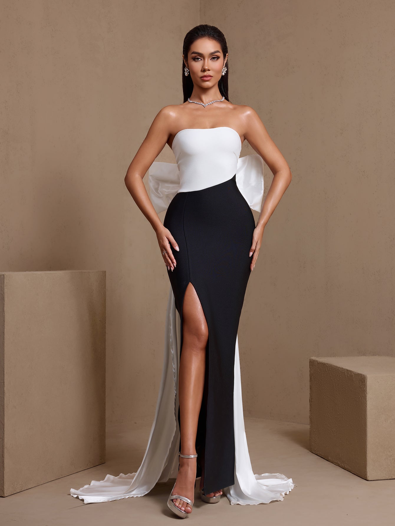 Black and white bow detail strapless bandage maxi dress, side-slit full-length view
