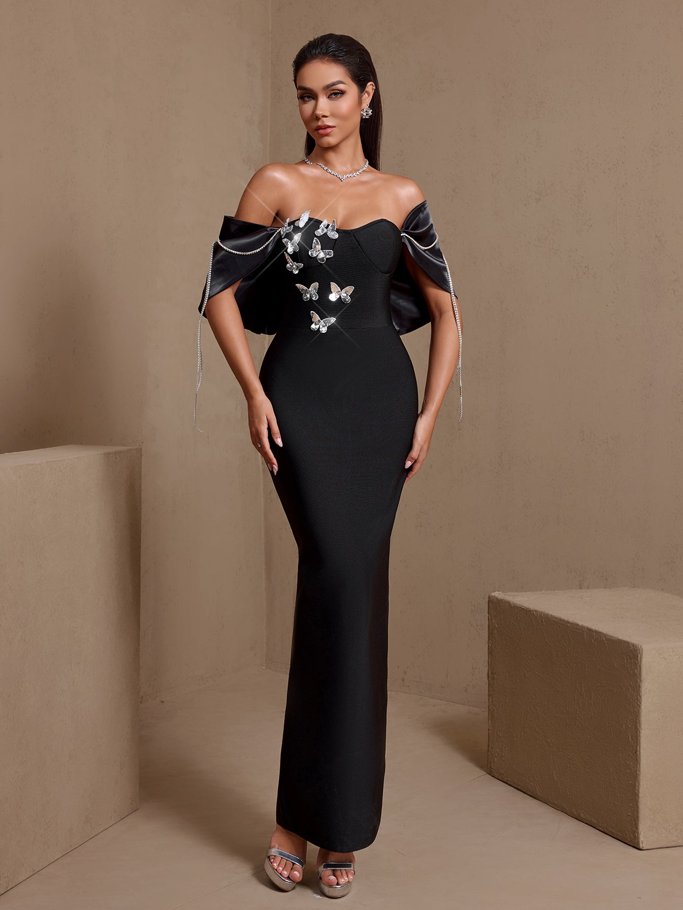 Black butterfly chain off-shoulder bandage maxi dress, front view