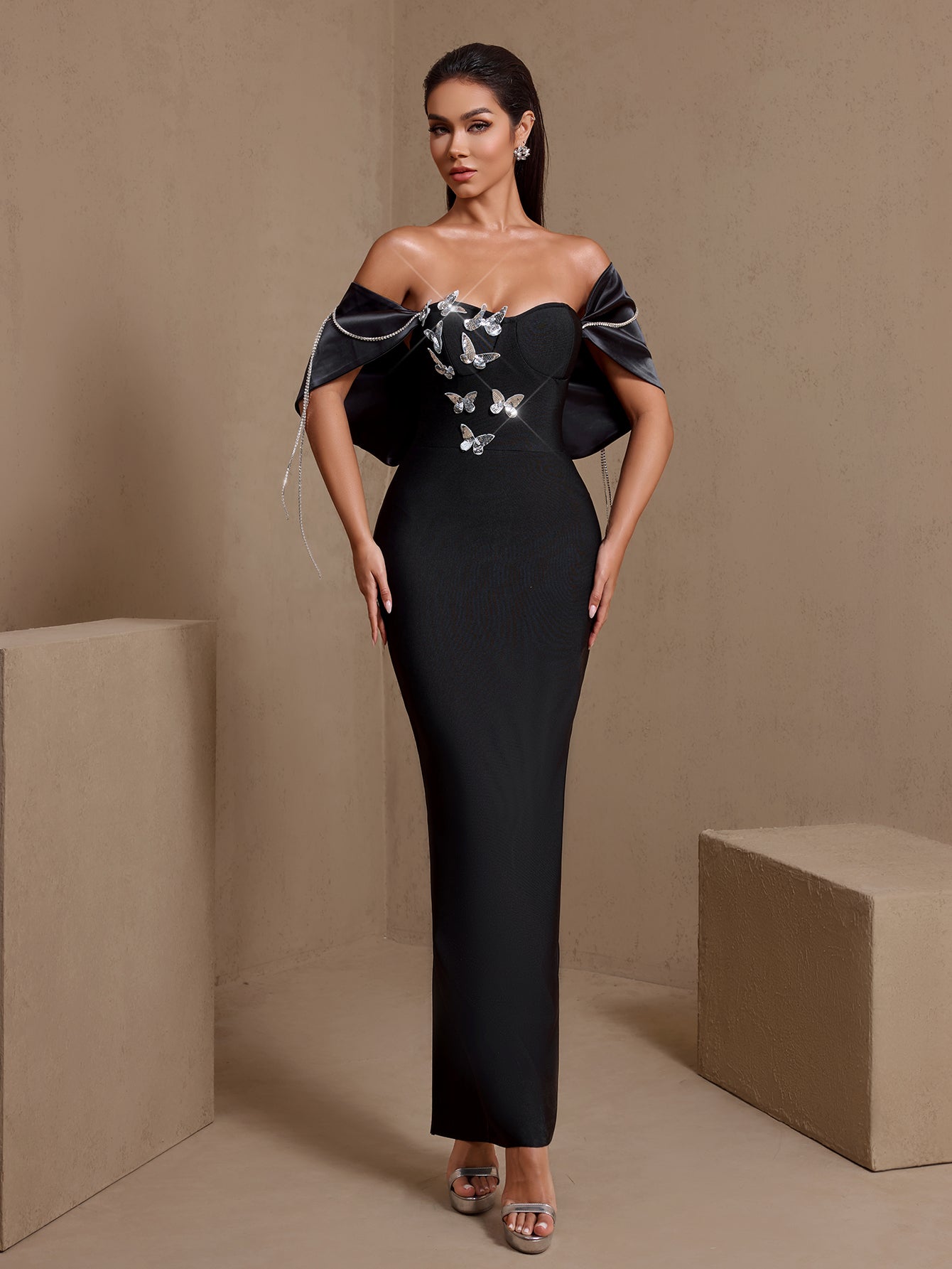 Black butterfly chain off-shoulder bandage maxi dress, full-length front view