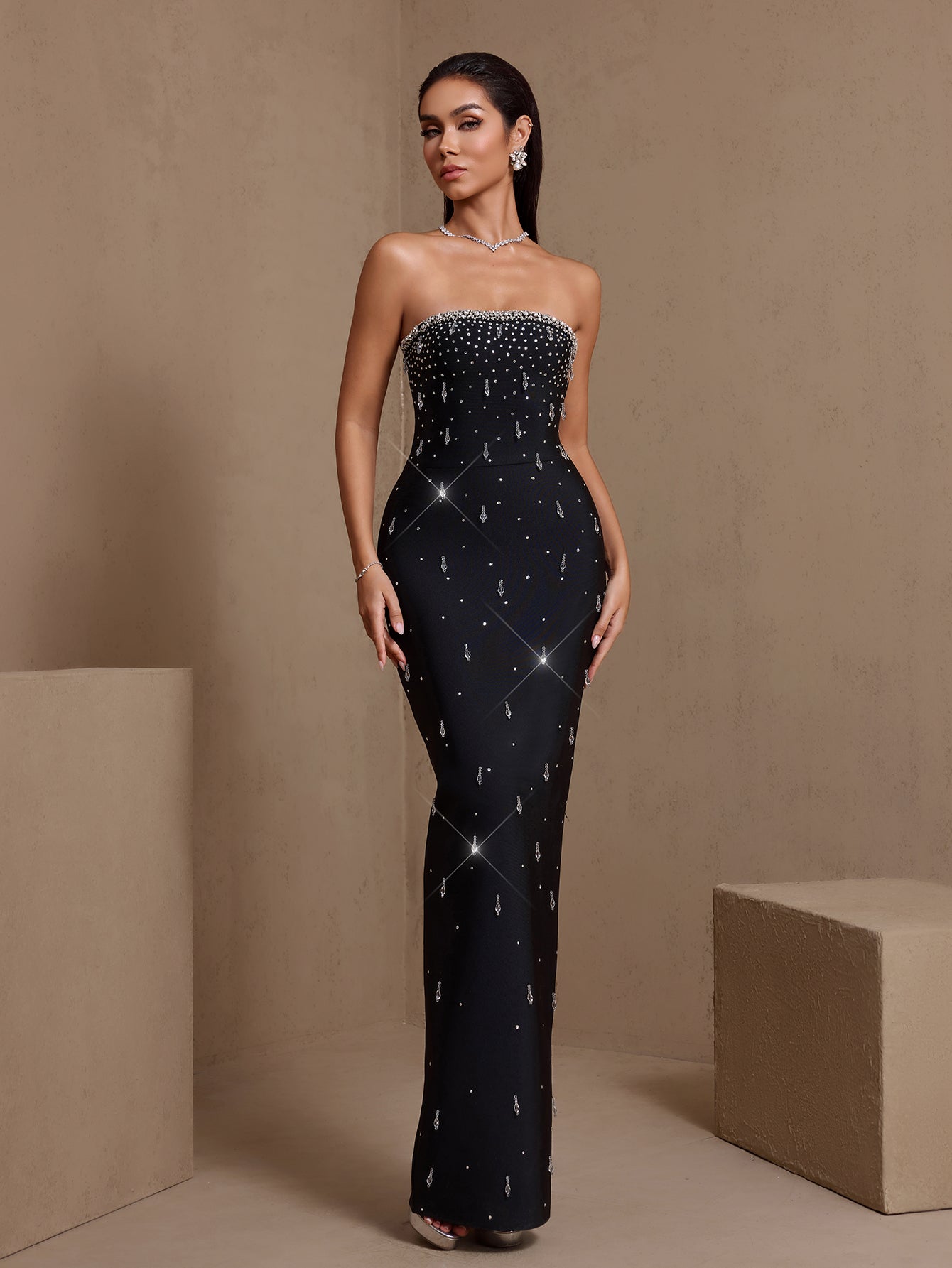 Black crystal-embellished strapless bandage maxi dress, front view