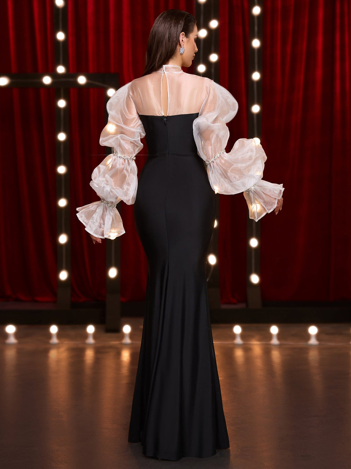 Black and white crystal puff-sleeve fishtail maxi dress, back view showing the zipper
