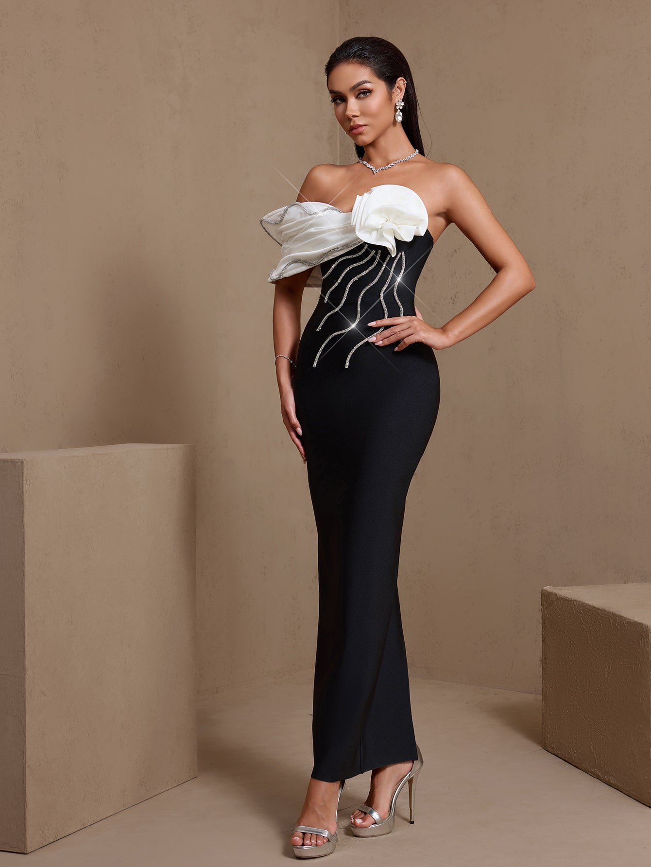 Crystal rosette off-shoulder bandage maxi dress, angled front view