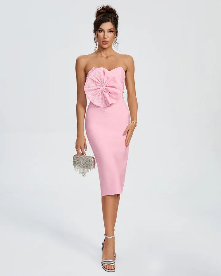 Photo of the Midi Dress Dauvina by Majestique in pink, featuring sculpted bow detail and strapless structured fit.