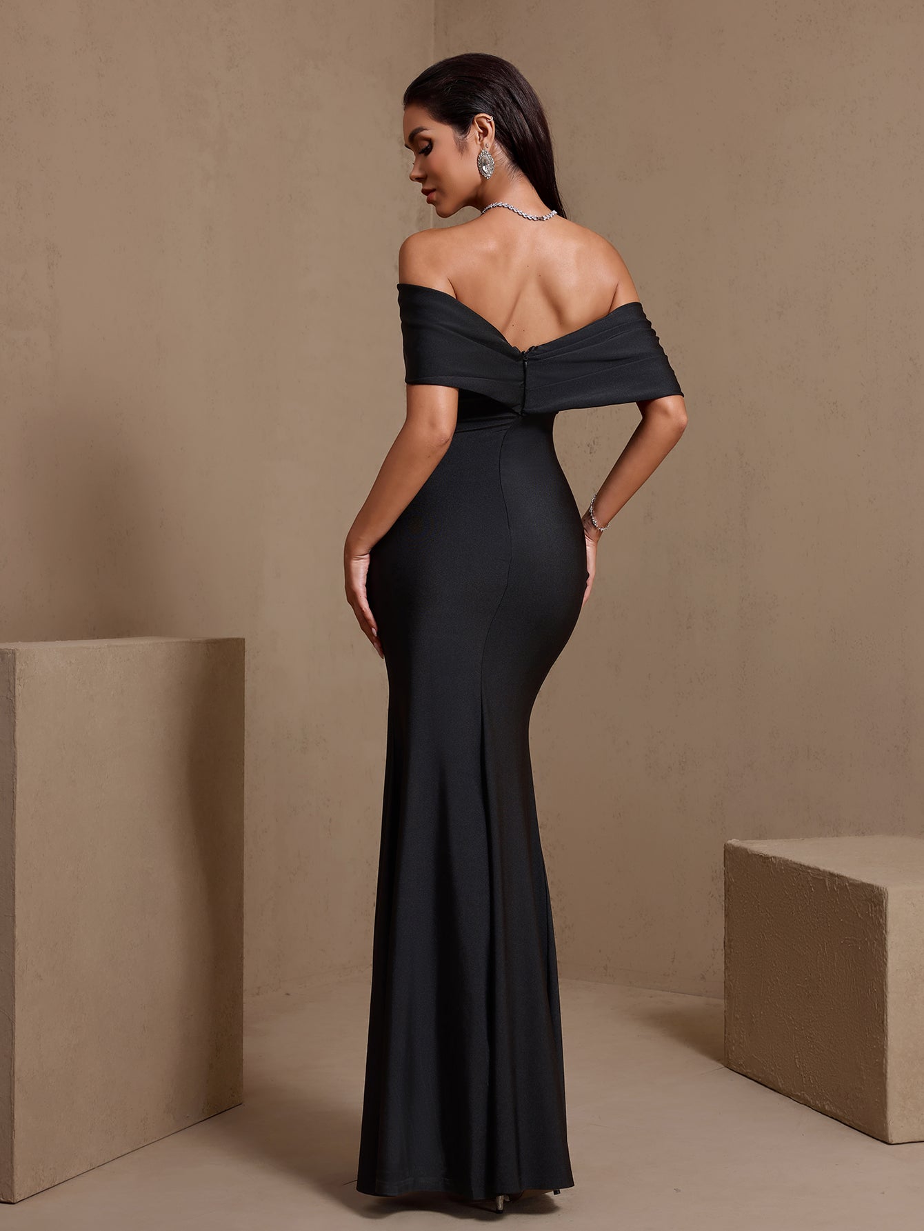 Black draped off-shoulder side-slit maxi dress, rear view