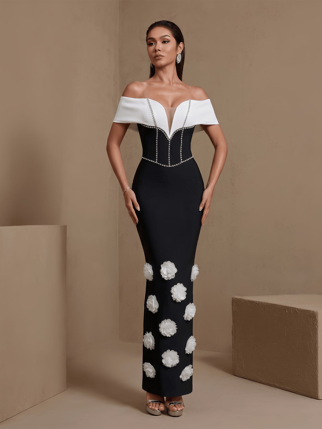 Black floral chain off-shoulder bandage maxi dress, front view