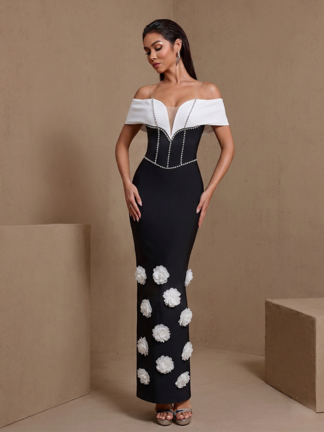 Black floral chain off-shoulder bandage maxi dress, angled front view