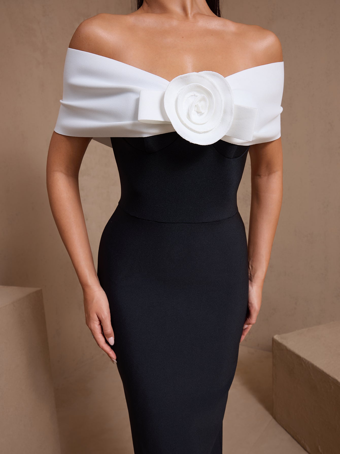 Black rosette off-shoulder bandage maxi dress, rosette neckline detail
