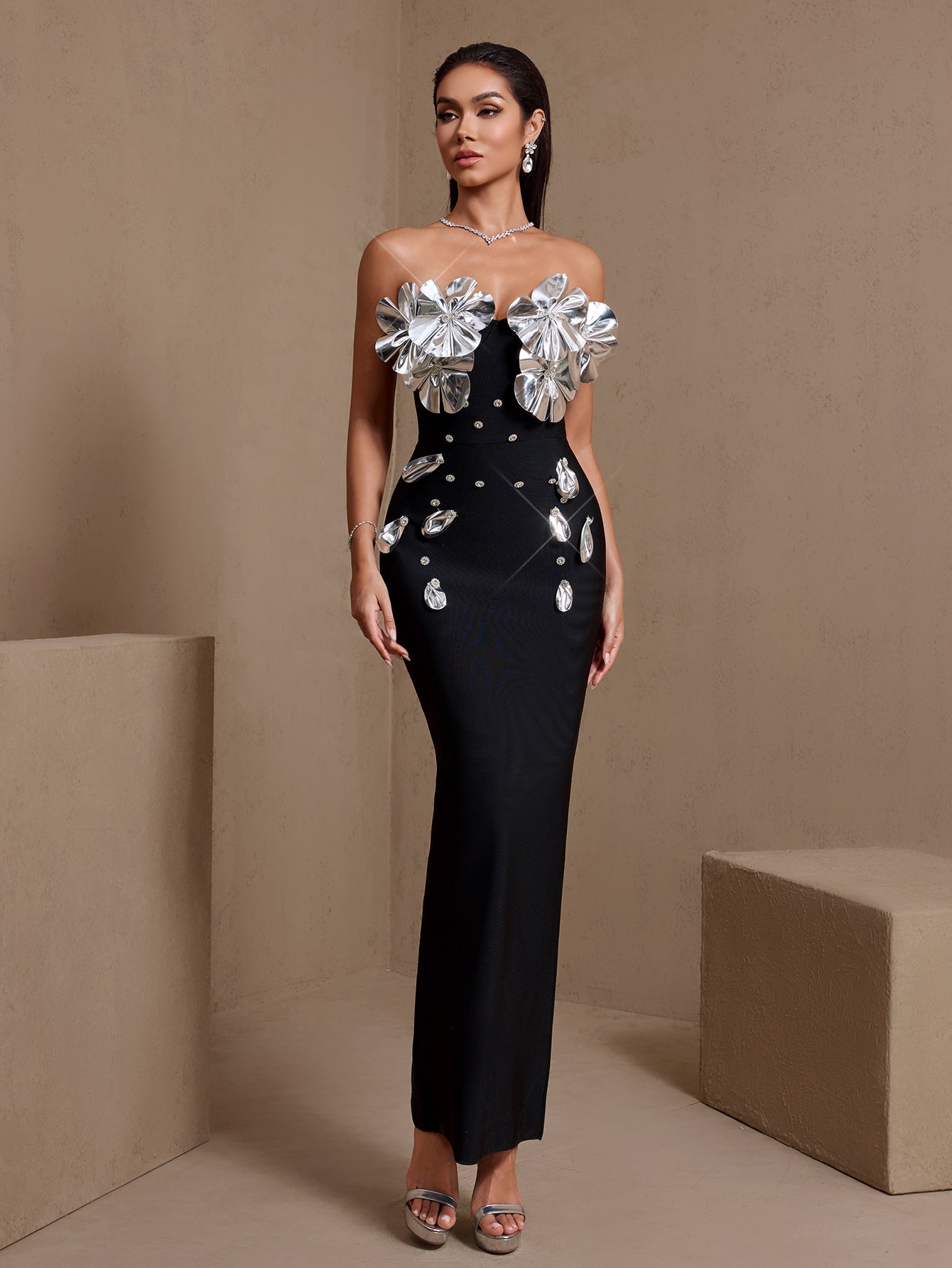 Black sculptural floral strapless bandage maxi dress, side view
