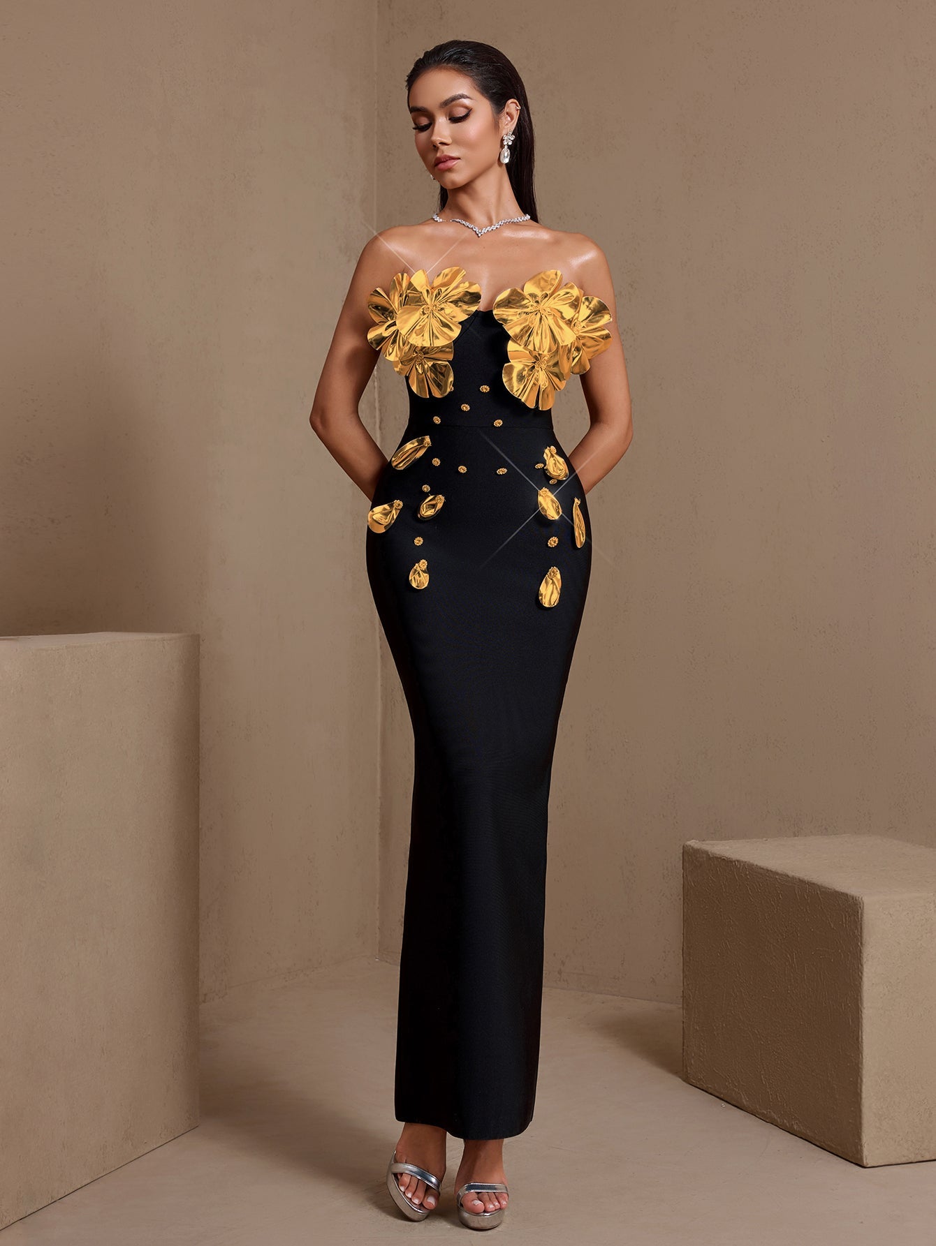 Black and gold sculptural floral strapless bandage maxi dress, front view