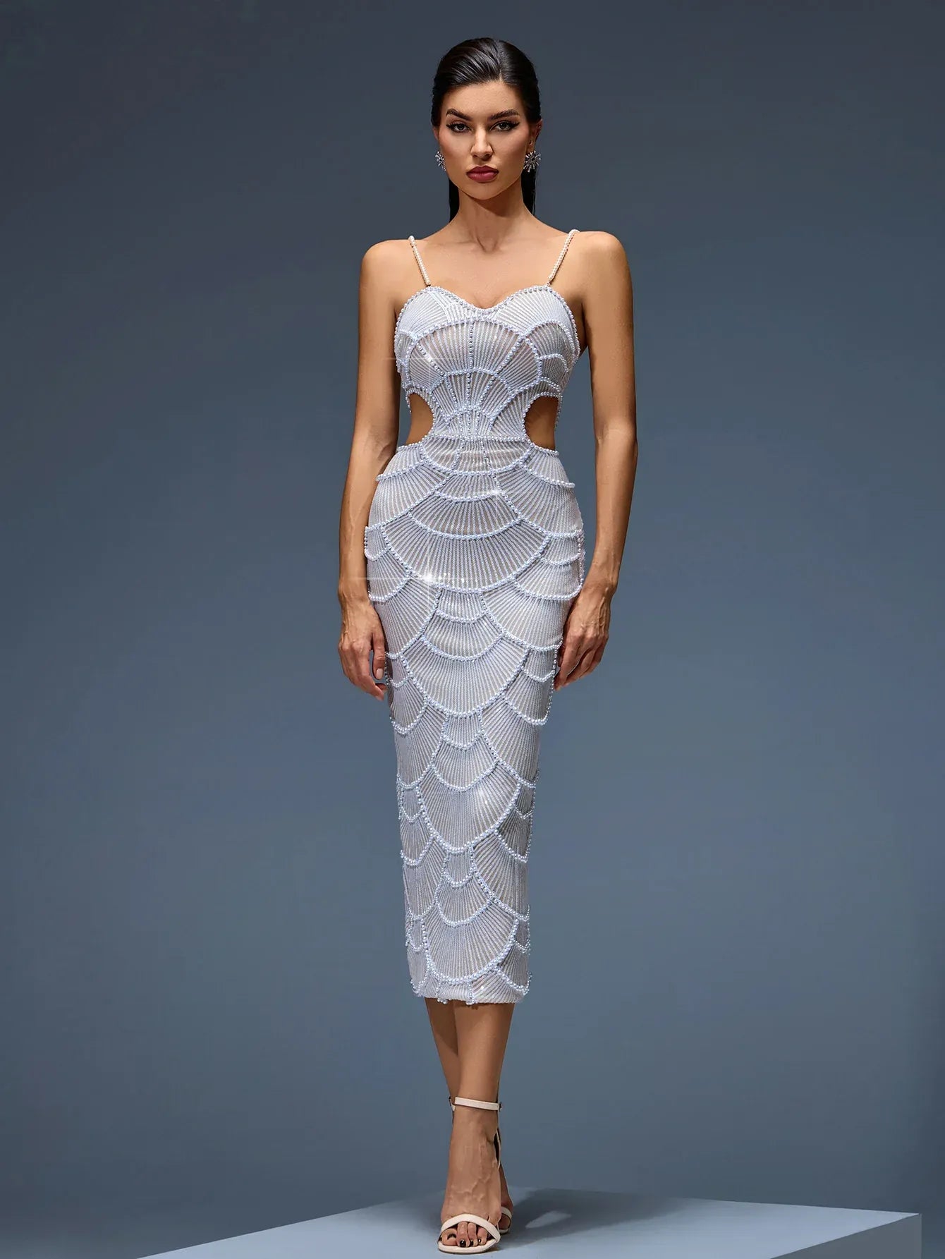 Photo of the Midi Dress Siren by Majestique in pearl white, featuring pearl embroidery, side cutouts, and sculpted fit.