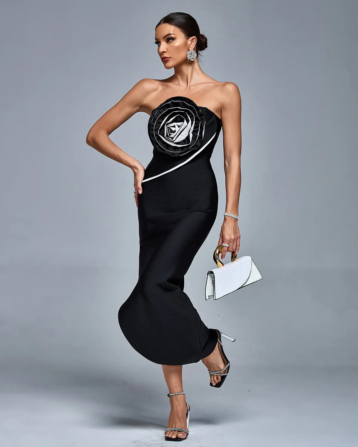 Photo of the Midi Dress Charme by Majestique in black, featuring structured floral bust and sculpted midi silhouette.